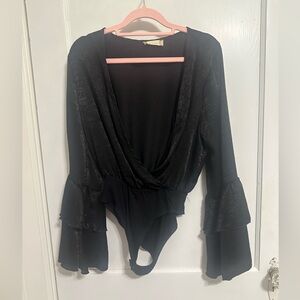 Black, open body suit from Alter’d state. Great layering piece. Worn 1-2 times.
